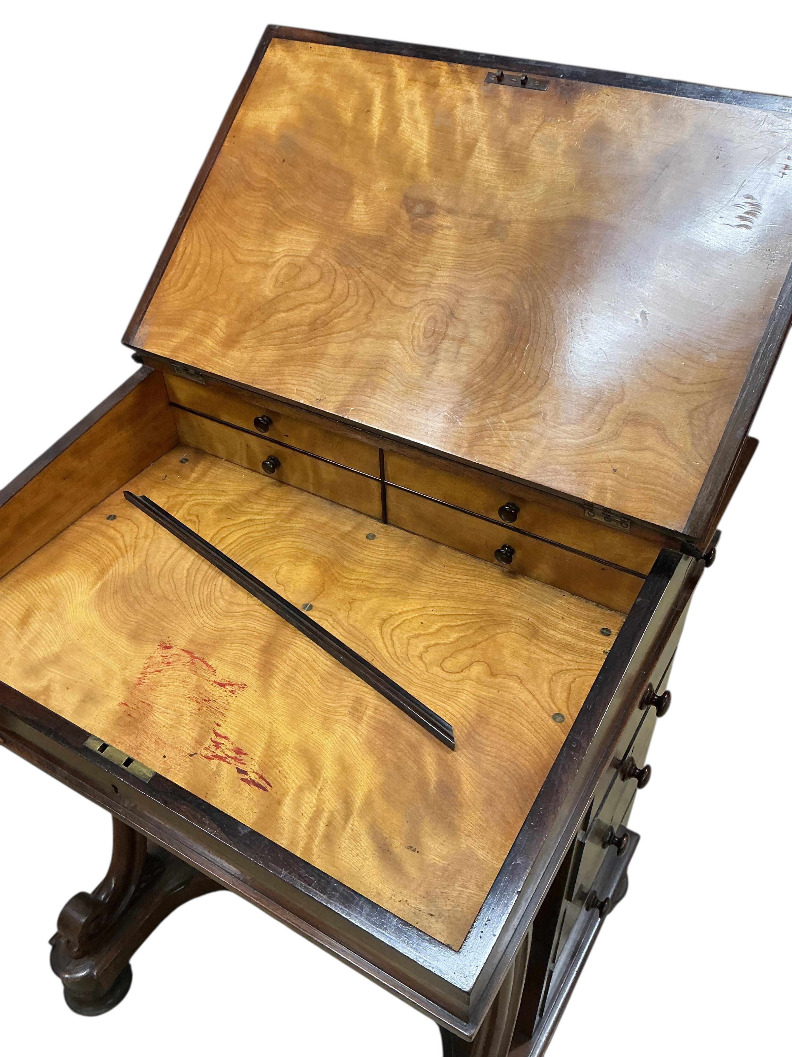 An early Victorian rosewood Davenport, width 60cm, depth 54cm, height 83cm